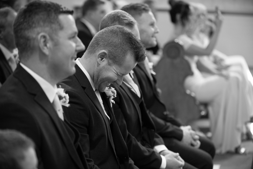 The Groomsmen laughing in the Church