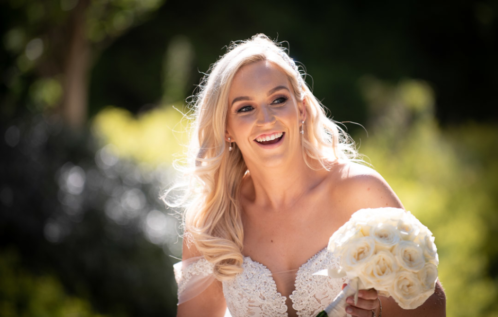 Bride laughing outside at Powerscourt Hotel
