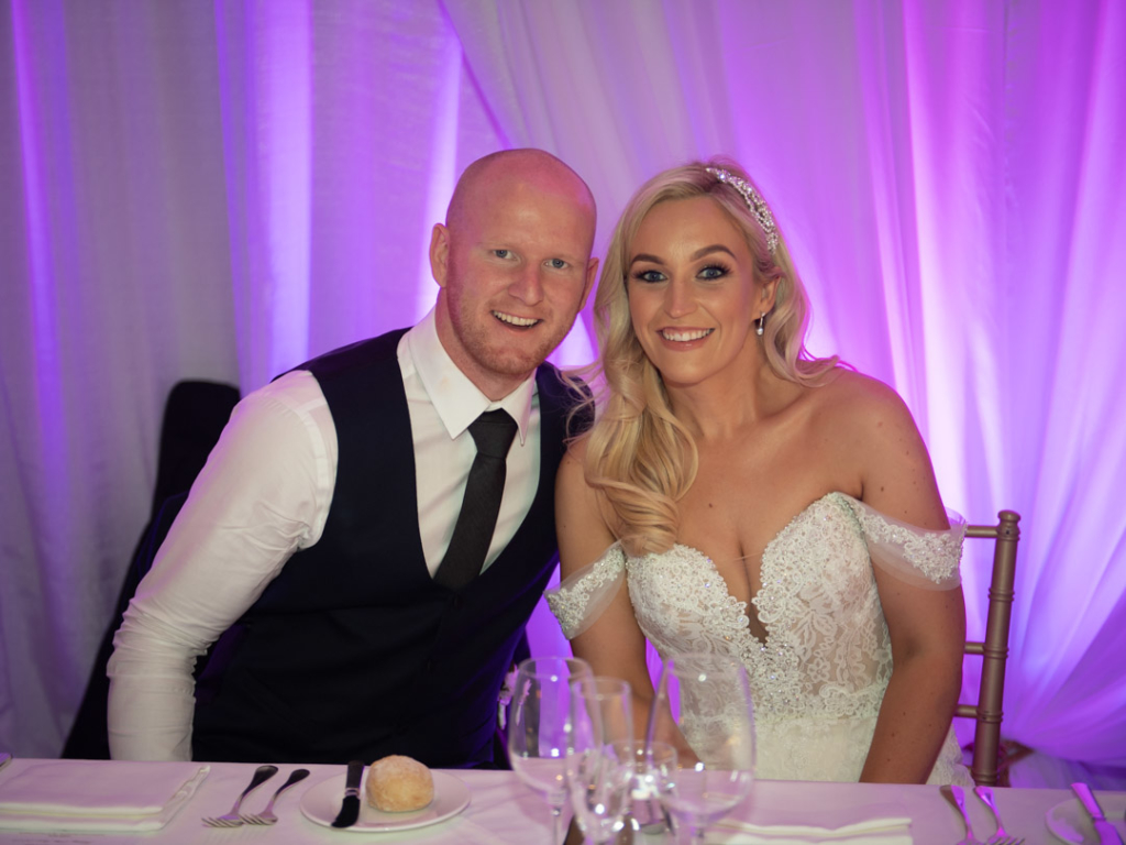 Bride and groom sitting at the top table at Powerscourt Hotel