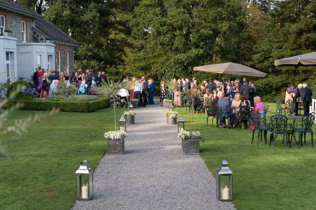 The guests outside at the drinks reception at the Virginia Park Lodge wedding